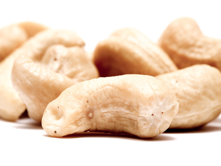 Close up of cashews on a white の写真素材