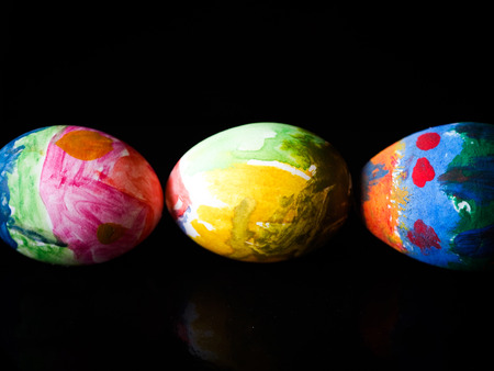 Painted easter eggs on a dark 