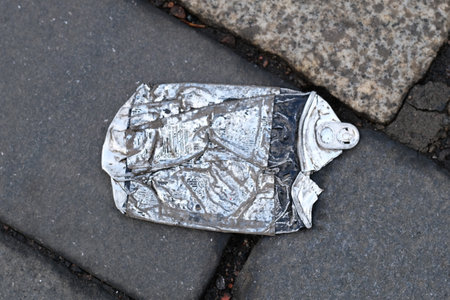 Flat tin can on the ground