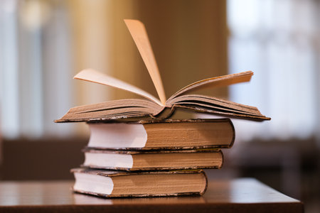 A stack of old books on a table