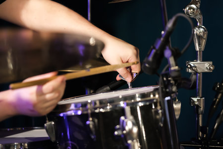 Tuning the drums with a pegの写真素材