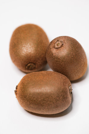 Three kiwi fruits on a white backgroundの写真素材