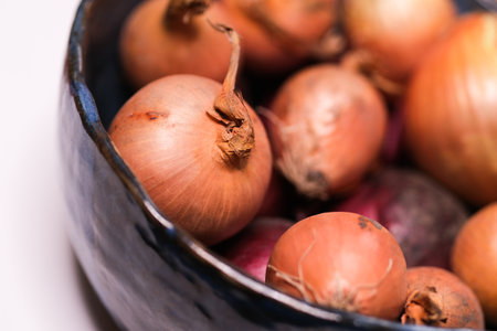 Many onions in a blue bowl