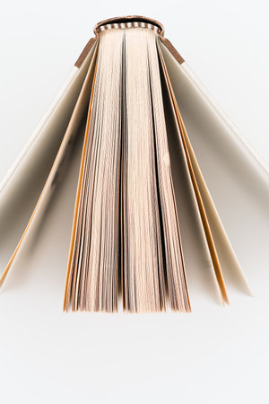 An open book from above on a white backgroundの写真素材