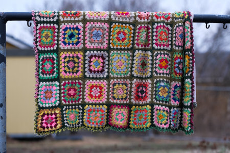 Patchwork quilt hanging outside