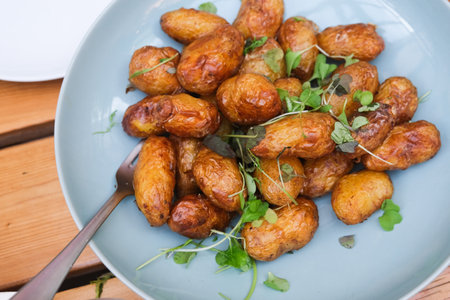 Roasted potatoes on a plateの写真素材