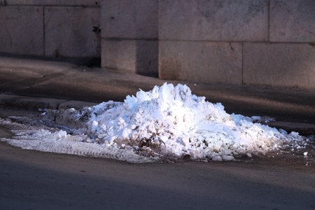 Snow at the side of a road in springの写真素材