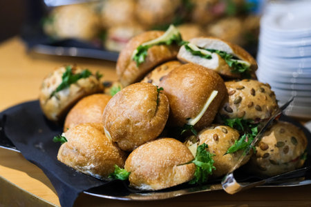 A pile of bread rolls with vegetable