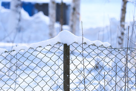 Chain link fence with snowの写真素材