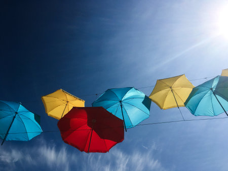 Colorful umbrellas on a line