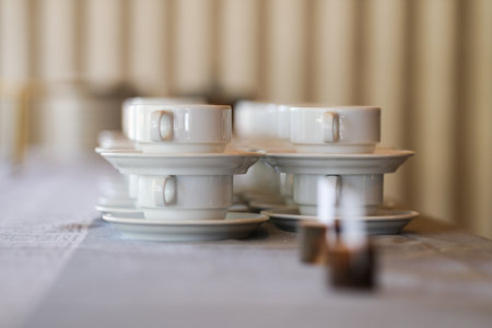 White coffee cups on a tableの写真素材