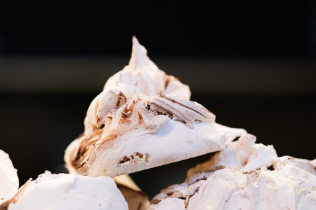 Meringue on a pile with a dark backgroundの写真素材