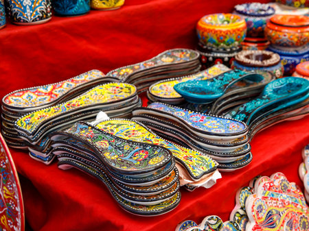 Authentic hand made traditional turkish dot painted ceramic spoon rest on weekly local market stall. Souvenir from Turkey. Close up, selective focusの写真素材