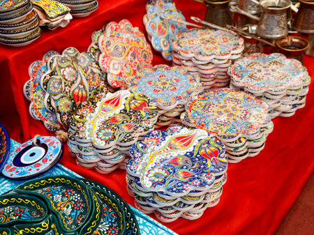 Authentic hand made traditional turkish dot painted ceramic Stand For Hot Dishes on weekly local market stall. Souvenir from Turkey. Close up, selective focusの写真素材
