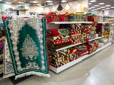 Assortment of wool carpets on shelves is sold in a turkish store in the mall. Textile and synthetic materials. Pamukkale, Turkey 30 June 2022のeditorial素材
