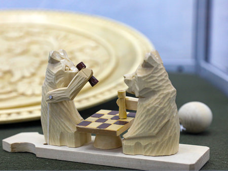 Two bears playing chess, Traditional russian wooden moving bogorodskaya toy. folk art. Souvenir from Russia.の写真素材