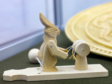 Rabbit or hare weaving lace, Traditional russian wooden moving bogorodskaya toy. folk art. Souvenir from Russia.の写真素材