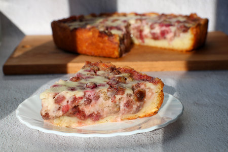 Close up of a piece of shortbread dough cake or pie with sour cream and strawberry Tsvetaevskiy. Spring summer food concept. homemade dessert.の写真素材