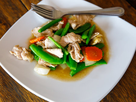 Stir Fry snow peas, Snap Peas or Sugar pea with pork and Oyster sauce (Thai name is Thua Lantao Phat Moo)の写真素材