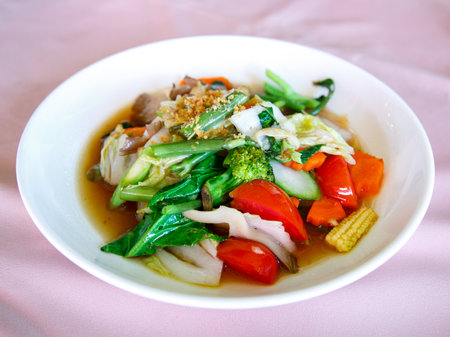 Stir-fried mixed vegetables with mushrooms and oyster sauce in a white plate. Thai healthy and delicious foodの写真素材