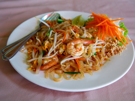Stir fried rice noodle thai style with shrimps and vegetables Pad Thai kung sod ,food popular with Thai and foreigners. Have a delicious national taste good.の写真素材