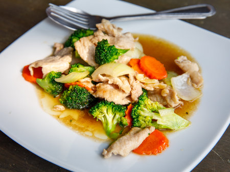 Broccoli stir fried with pork in oyster sauce, thai healthy food. Close up, selective focusの写真素材