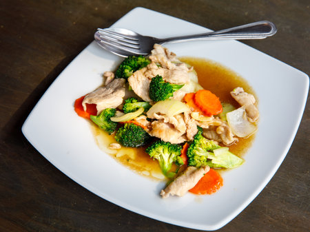 Broccoli stir fried with pork in oyster sauce, thai healthy food. Close up, selective focusの写真素材