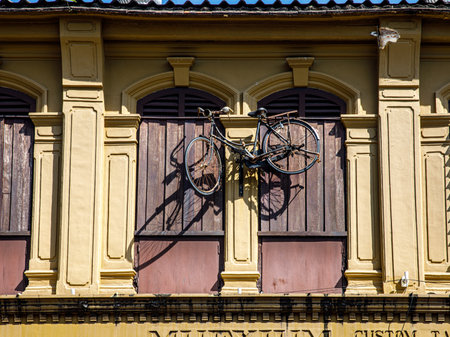 Old buildings Sino Portuguese style in Phuket town Thailand. architectural style is European mixed with Chinese modern. window and bicycleの写真素材