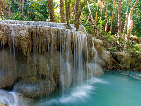 Landscape view of Erawan waterfall Kanchanaburi Thailand. Erawan National Park is home to one of the most popular falls in Thailand. Fifth floor of Erawan waterfall Buea Mae Long.の写真素材