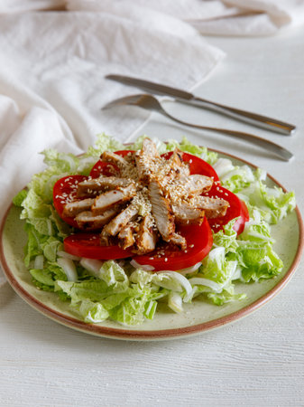 Healthy Homemade Sesame Salad with Chicken Tomato and Chinese cabbage. vertical.の写真素材