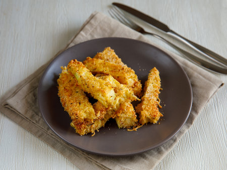 crunchy zucchini sticks breaded with breadcrumbs, parmesan cheese, spicesの写真素材