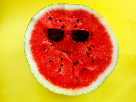spring summer holiday and vacation background concept. Sliced watermelon and sun glassesの写真素材