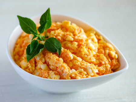 Fresh carrot salad with garlic and cheese. Top view, deep for sandwich