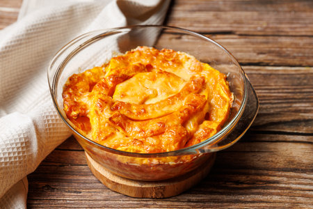 Casserole Roasted pumpkin with parmesan cheese baked in glass baking sheet. Vegetarian healthy food, autumn recipeの写真素材