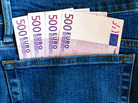 500 euro banknotes in blue jeans pocket top view with copy space. Money, business, finance, saving, banking, wealth, waste concept. Exchange Rates.の写真素材