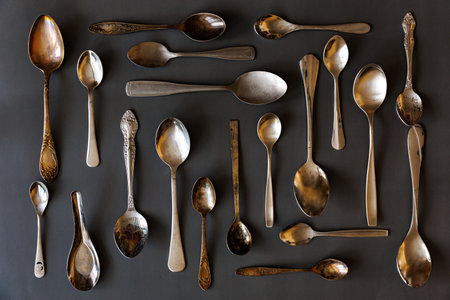 Assortment of vintage spoons, flat lay top viewの写真素材