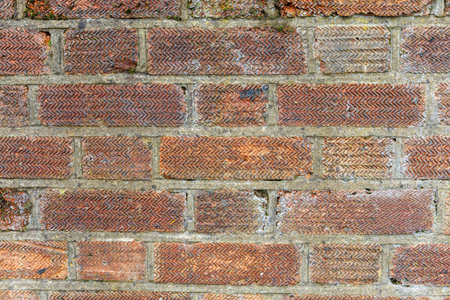 Brown red grunge weathered brick wall, abstract full frame background texture with old dirty and vintage style pattern. Close upの写真素材