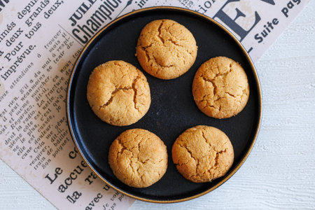 Quick Easy Vegan Tahini Cookies on black plate top viewの写真素材