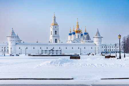 White Tobolsk Kremlin in winter. Guest Yard, domes of the St. Sophia Assumption Cathedral and bell towers, ancient Russian architecture of the XVII century, only stone kremlin in Siberia at dayの写真素材