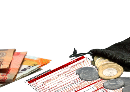 Indian Individual Income Tax Form ITR with Indian coins on isolated background