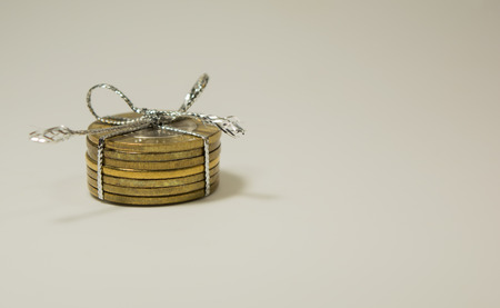 Indian 10 Rupee Coins tied with thread on isolated white background.の写真素材