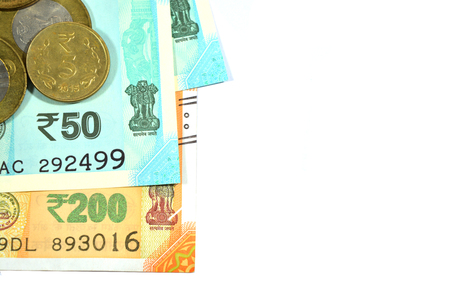 New Indian 50 and 200 rupees with 10 and 5 rupees coins on white isolated white backgroundの写真素材
