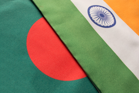 Bangladesh and Indian flags placed on tableの写真素材
