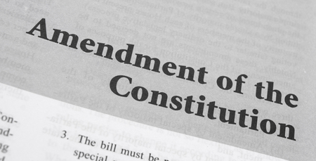 Amendment of the Constitution printed on book with large letters.