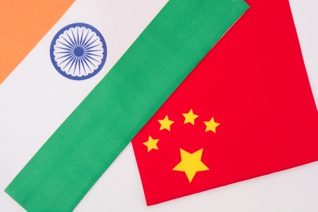 China and India flag together on isolated backgroundの写真素材