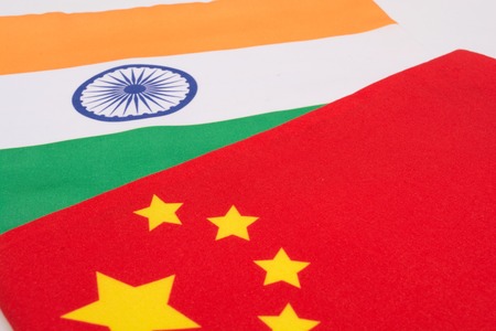 China and India flag together on isolated backgroundの写真素材