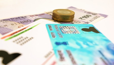 Aadhar card and pan card which are issued by Government of India as an identity card with Indian...