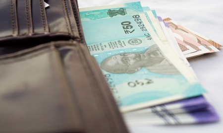 Colseup of Indian currency coming out of his pocketの写真素材