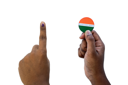 Concept of Indian election,Holding sticker of vote for better Indian on isolated backgroundの写真素材