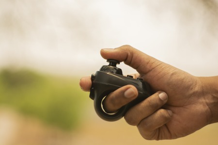 Closeup of hand using Virtual Reality gamingの写真素材